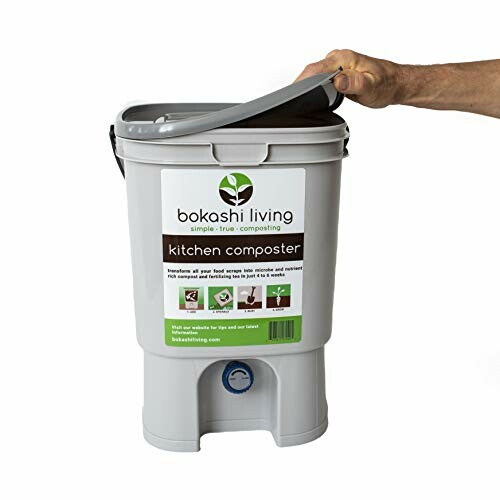 Person lifting lid of Bokashi kitchen composter