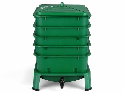 Green worm composting bin with multiple stacked trays and spigot.