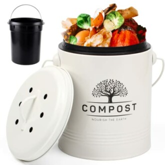 Kitchen compost bin filled with vegetable scraps and a black inner bucket.